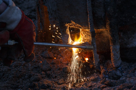 Welding machine with melting metal drops and sparks of sparks.
