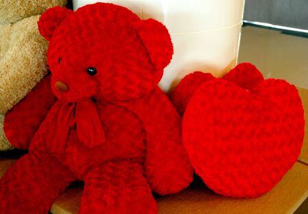 red huggy bear with red heartの写真素材