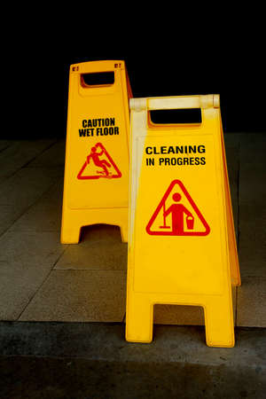 caution wet floor and cleaning in progressの写真素材