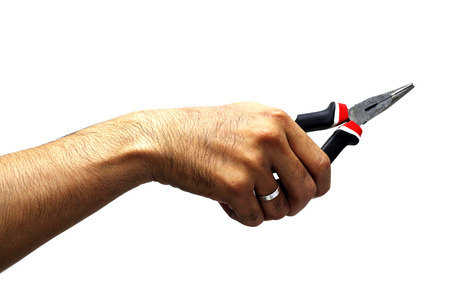 hand holding a plierの写真素材