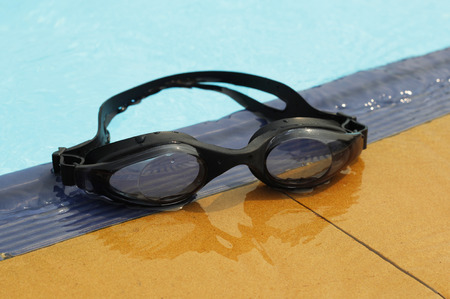 swimming glasses in swimming poolの写真素材