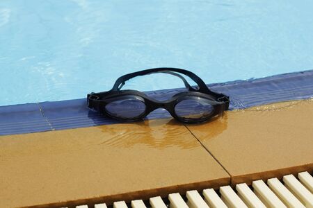 swimming glasses in swimming poolの写真素材