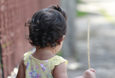 behind view of little girlの写真素材