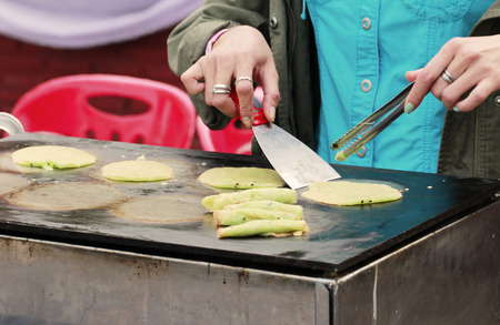person hand try to roll Thai pandanus pancake,Thai desert styleの写真素材