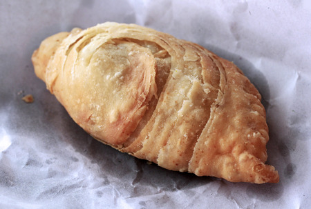 Close up curry puff on white paperの写真素材