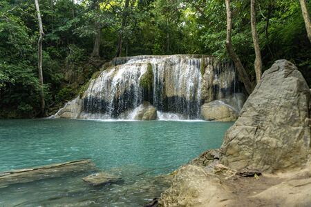 Clean green emerald water from the waterfall Surrounded by small trees - large trees,  green colour, Erawan waterfall, Kanchanaburi province, Thailandの写真素材