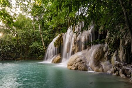 Clean green emerald water from the waterfall Surrounded by small trees - large trees,  green colour, Erawan waterfall, Kanchanaburi province, Thailandの写真素材
