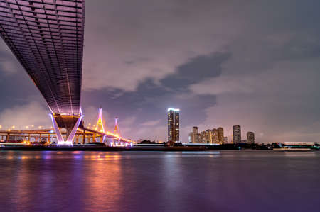 Bridge over the Chao Phraya River, turn on the LED lights at dusk.の写真素材