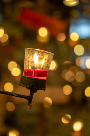 Red candles in clear glass. Candles in glass. Candles decorate in house.の写真素材