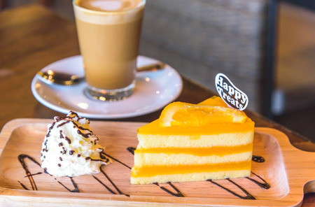 A cup of  hot coffee and cake.の写真素材