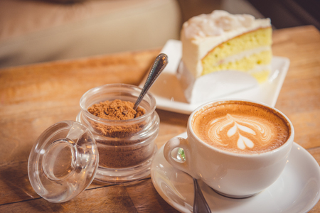 A cup of  hot coffee and cake.の写真素材