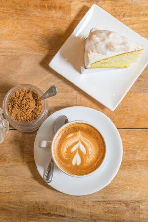 A cup of  hot coffee and cake.の写真素材