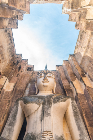 Buddha image in Wat Sri Chum temple at Sukhothai Historical Park, Thailand.の写真素材