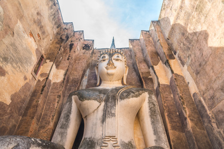 Buddha image in Wat Sri Chum temple at Sukhothai Historical Park, Thailand.の写真素材