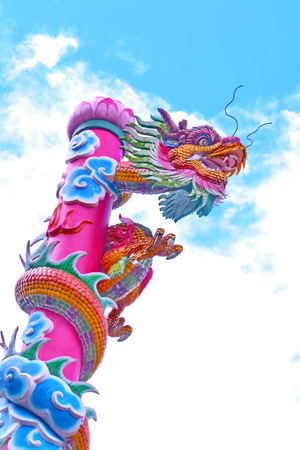 Dragon, Poles move towards a pan dragon sculpture sky  Symbol of faith that conveys power, fortune and faith の写真素材