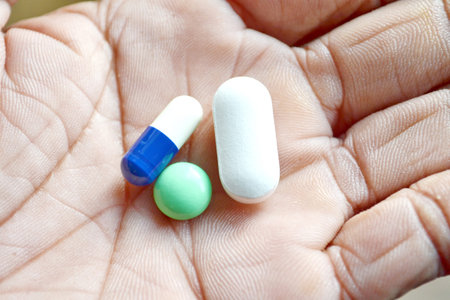 Close-up shot of a hand holding  pills