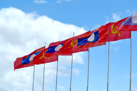 Laos Flag on Sky and clouds backgroundの写真素材