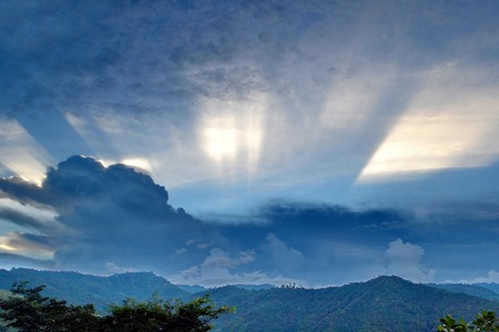 Clouds roll over the volcanic mountaintop during a rainy seasonの写真素材
