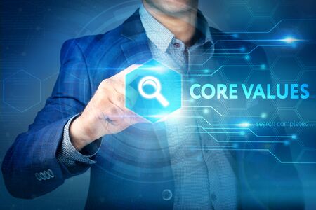 Business, internet, technology concept.
Businessman chooses Core Values button on a touch screen interface.の写真素材