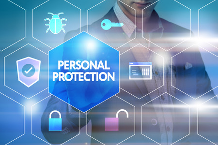 Business, technology, internet and networking concept. Businessman presses a button on the virtual screen: Personal protectionの写真素材