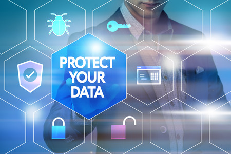 Business, technology, internet and networking concept. Businessman presses a button on the virtual screen Protect your dataの写真素材
