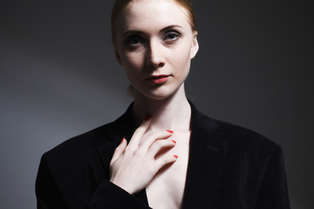 Fashion art studio portrait of elegant girl in geometric black and white backgroundの写真素材