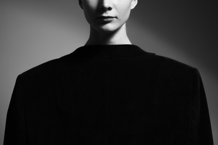 Fashion art studio portrait of elegant girl in geometric black and white background.の写真素材