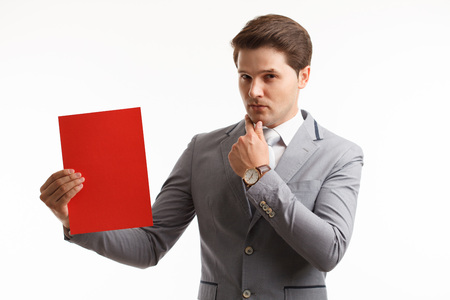 Businessman showing signboard. In studio on a white background.の写真素材
