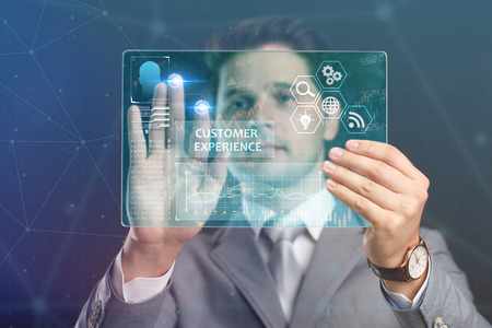 The concept of business, technology, the Internet and the network. A young entrepreneur working on a virtual screen of the future and sees the inscription:customer experienceの写真素材