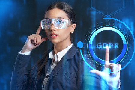 Business, Technology, Internet and network concept. Young businessman working on a virtual screen of the future and sees the inscription: GDPRの写真素材