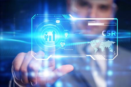 The concept of business, technology, the Internet and the network. A young entrepreneur working on a virtual screen of the future and sees the inscription: CSRの写真素材
