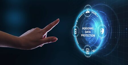 Business, technology, internet and networking concept. Young businessman working  in the office, select the icon Personal data protection on the virtual display.                               の写真素材