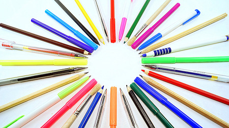 pens, pencils, brushes and pens lined circleの写真素材