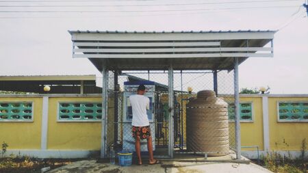 A boy and drinking water tankの素材