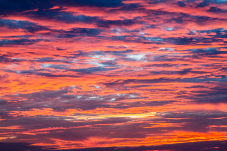 The vast Beautiful sky and four orange clouds that are beautiful sky before sunset. The natural sky before background has a breeze on a bright day in the summer.の写真素材