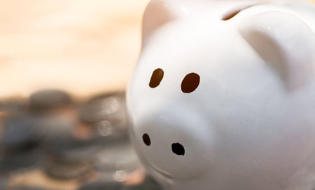 Piggy bank placed on the table, Concept of saving or investment. planning savings money of coins to buy a home concept for property, mortgage investment.の写真素材