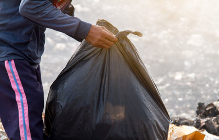 Garbage collector. waste plastic bottles and other types of plastic waste at the Thilafushi waste...