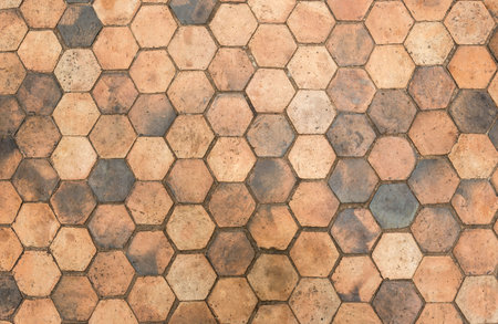 Vintage Yellow hexagon flooring surface. Top view with copy space. Background for design. Old yellow hexagon floor surface abstract background.の写真素材