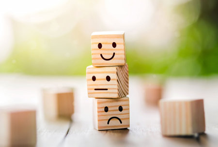 Wooden cube block shape with icon face smiley, The best excellent business services rating customer experience,Satisfaction survey concept. Customer service evaluation and satisfaction survey conceptsの写真素材