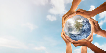 Conceptual symbol of multiracial human hands surrounding the Earth globe. Unity, world peace,...