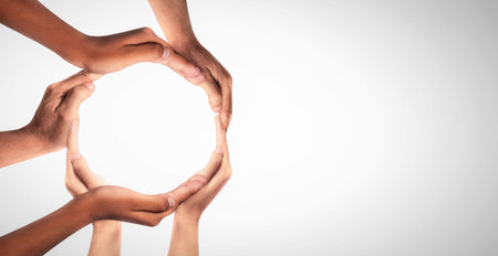 Symbol and shape of circle created from hands.The concept of unity, cooperation, partnership, teamwork and charity. diversity of a diverse group of people connected together as a supportive symbol.の写真素材
