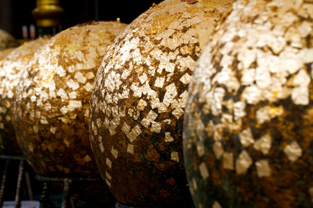 Boundary stones blessing, round stones buried in the ground to mark the sacred limits of a templeの写真素材