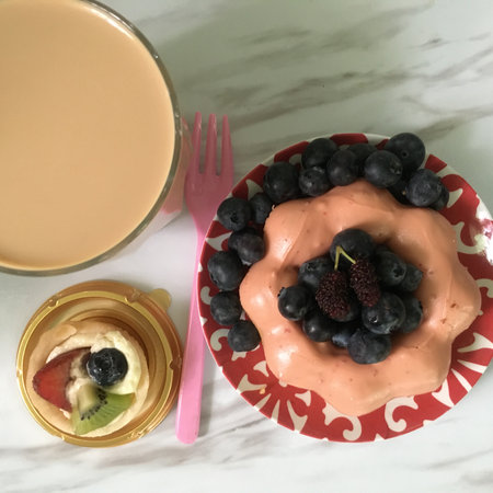 Top view of cup of coffee and cake with blueberryの写真素材