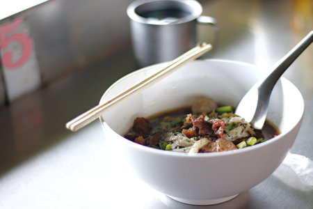 Noodle Soup Thai Style with pork and pork ball. Soup was made from pig's blood. Select focus.