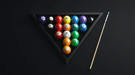 Set of billiard balls arranged in triangle with cue chalked besideの素材