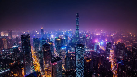 A stunning aerial view of a vibrant city skyline illuminated at night. Spectacular lights and high-rise buildings create a dynamic urban landscape, showcasing the beauty of modern architecture.の素材