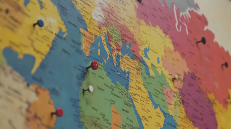 A vibrant world map featuring colorful regions marked with pins. Perfect for travel planning, educational purposes, or as a decorative element in any space.の素材
