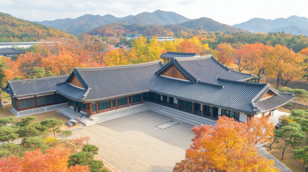 Explore a stunning traditional building surrounded by vibrant autumn foliage. This serene landscape offers a perfect blend of nature and culture.の素材