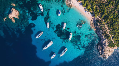 A breathtaking aerial view showcasing boats anchored in crystal-clear blue water near a sandy beach, perfect for leisure and travel enthusiasts.の素材