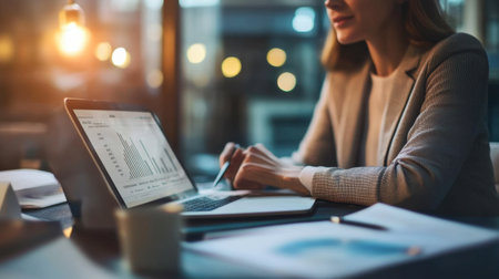 A business professional discussing a project with a client over a virtual meeting.の素材